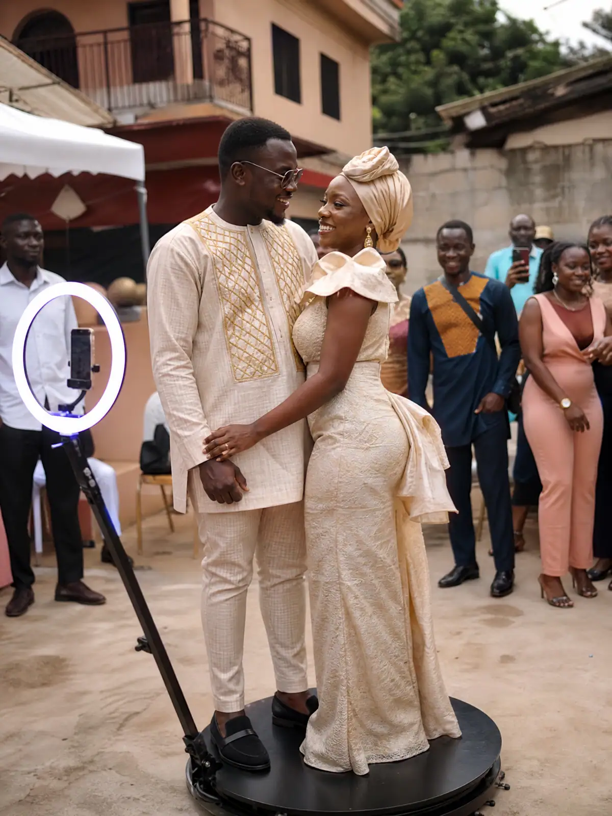 Couple in traditional attire on the 360 booth in a family compound in Freetown